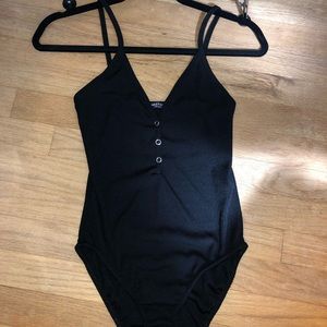 Black bodysuit with snap buttons